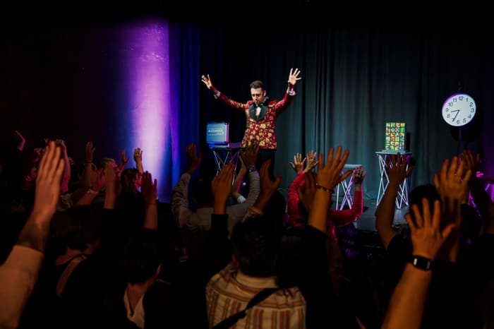 The audience applauding Alexander Main at the end of the show
